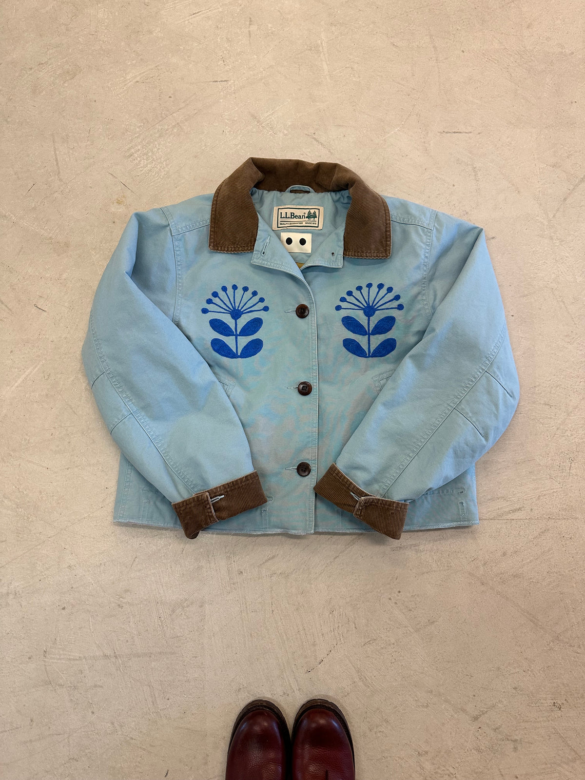 LL Bean Barn Jacket in sky blue with chainstitched Nordic flowers