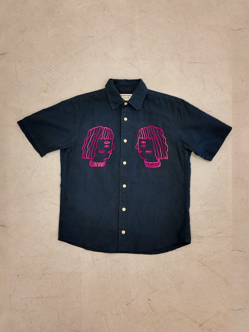Faces shirt laid flat