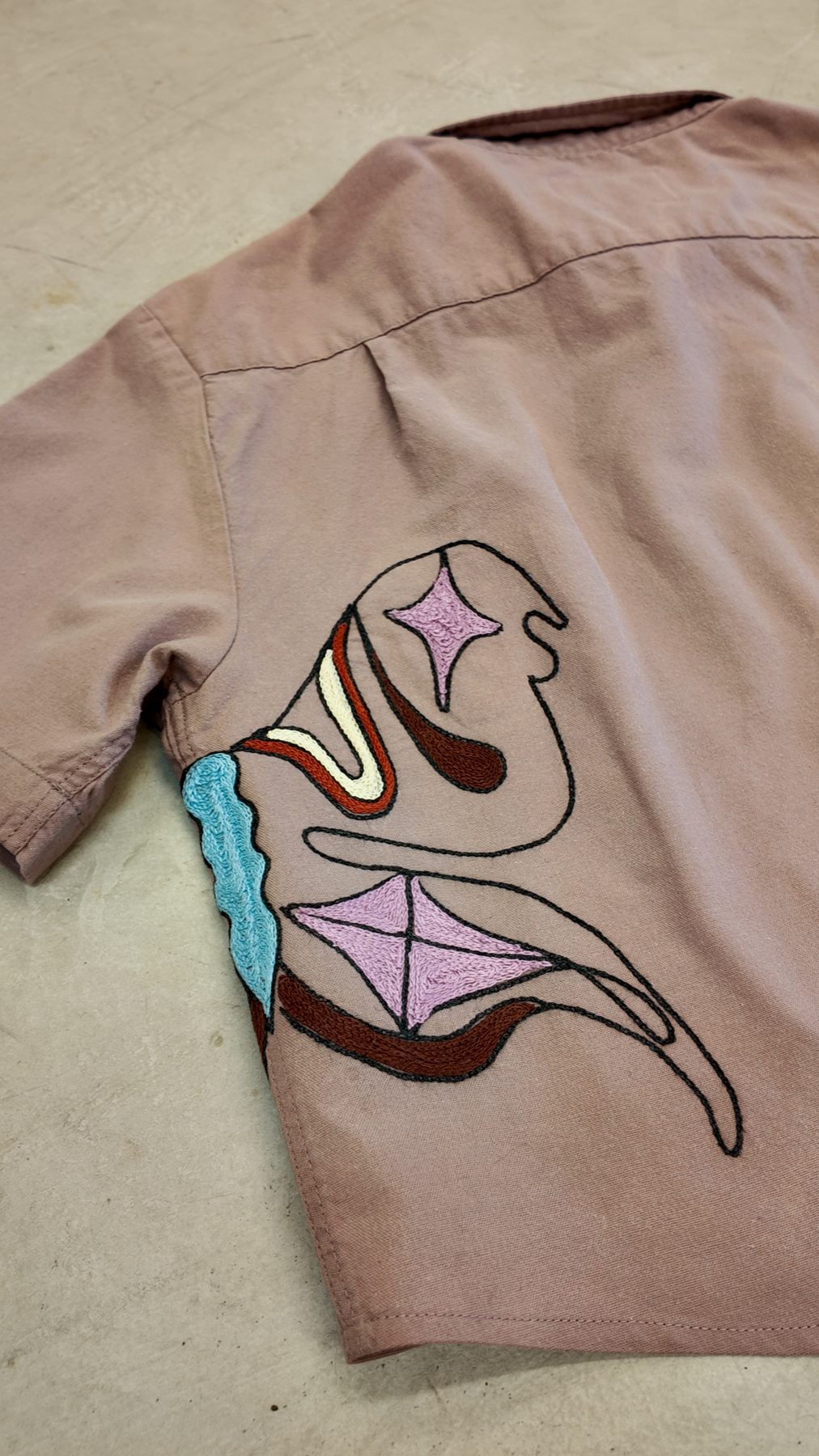 Moth wing stitched across the side seam