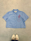 Cropped Button Down — Light Blue with Red Floral Buds in a Vase