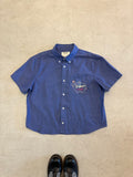 Cropped Button Down — Mid Blue Shirt with Pink Elephant detail on Chest Pocket