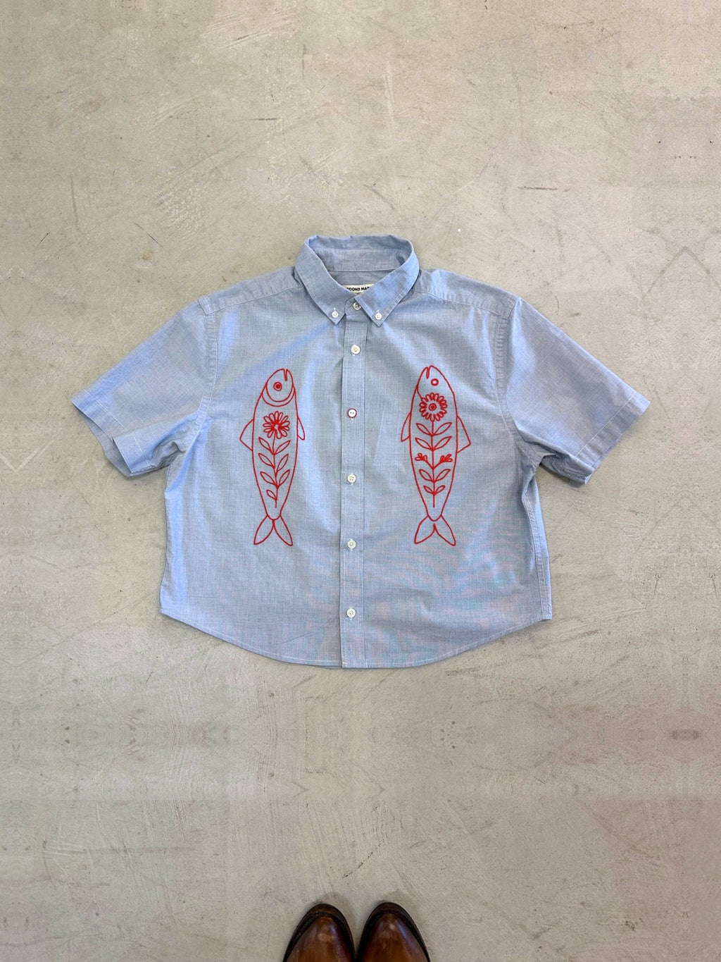 One-of-one vintage cropped short sleeve button-down in light grey/blue with hand-chainstitched red fish embroidery on the chest