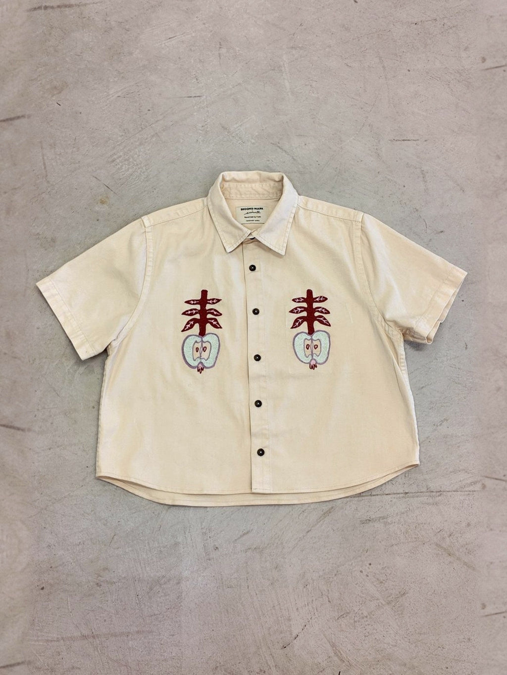 Apples shirt laid flat