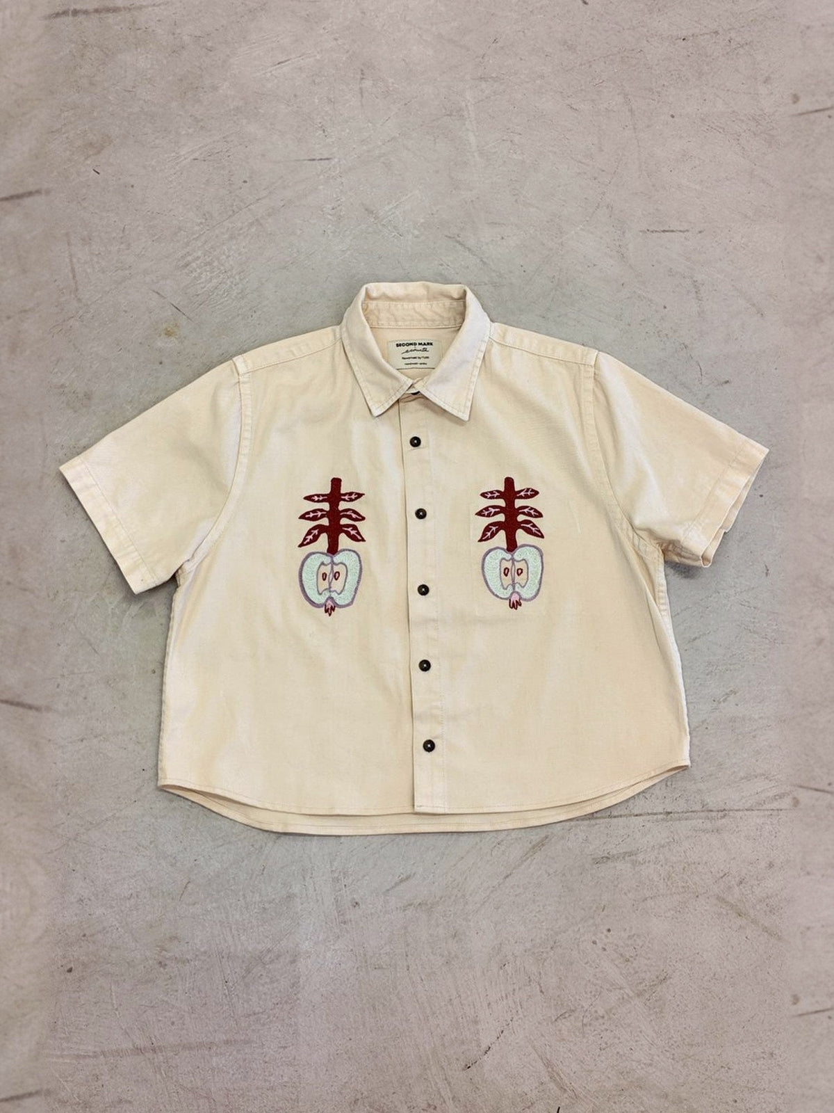 Apples shirt laid flat