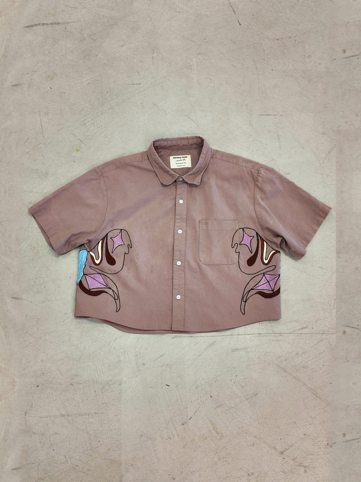 Moth shirt laid flat