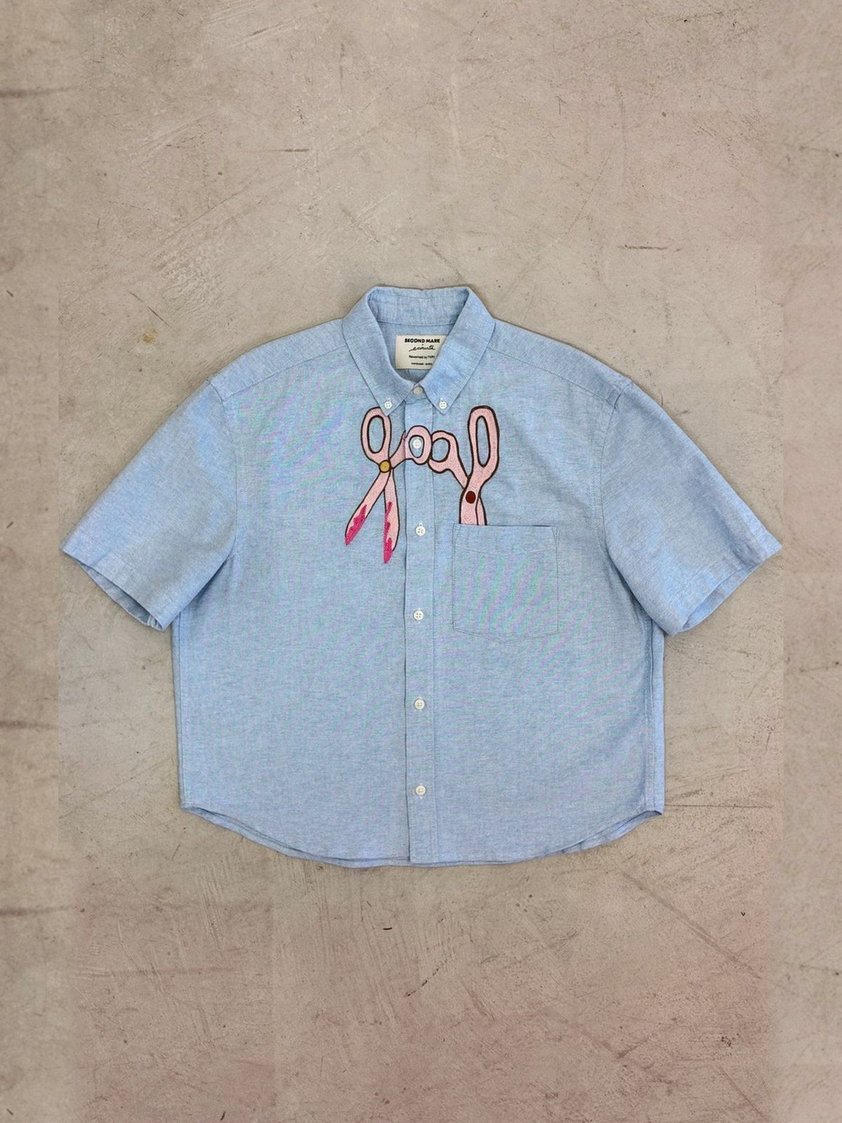 Scissors shirt laid flat