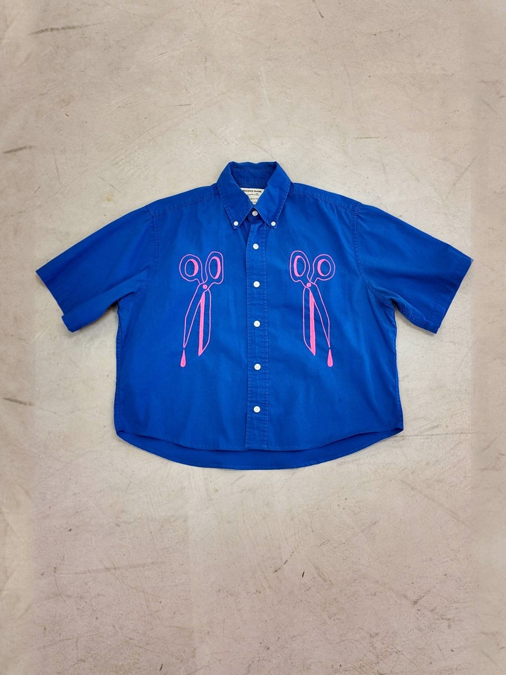 Scissors pair shirt laid flat