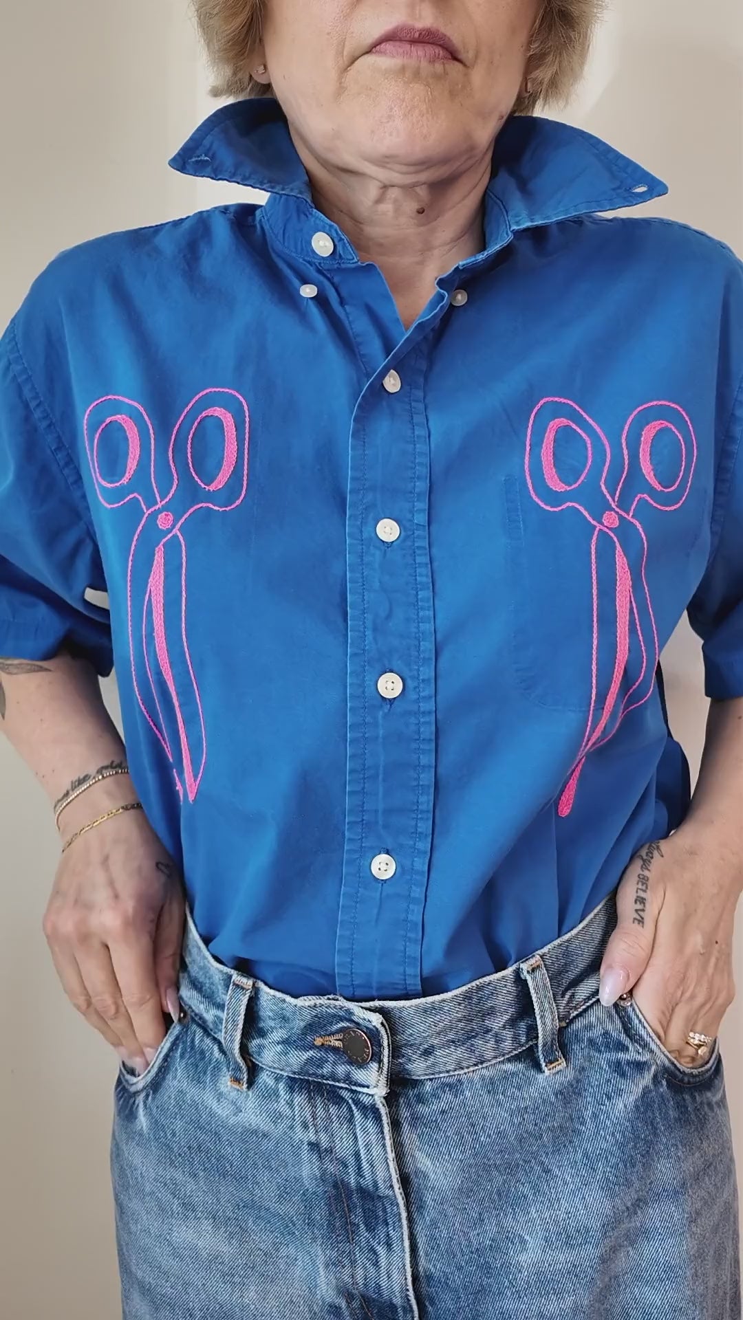 Try-on of the Emily Counts scissors pair shirt