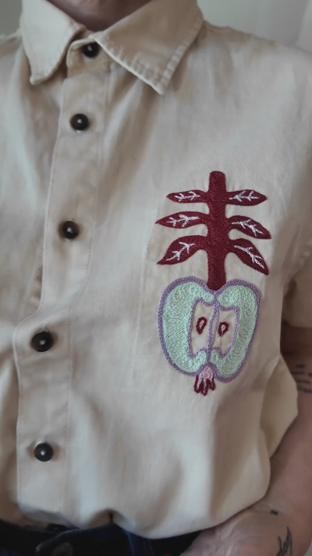 Try-on of the Emily Counts apples shirt