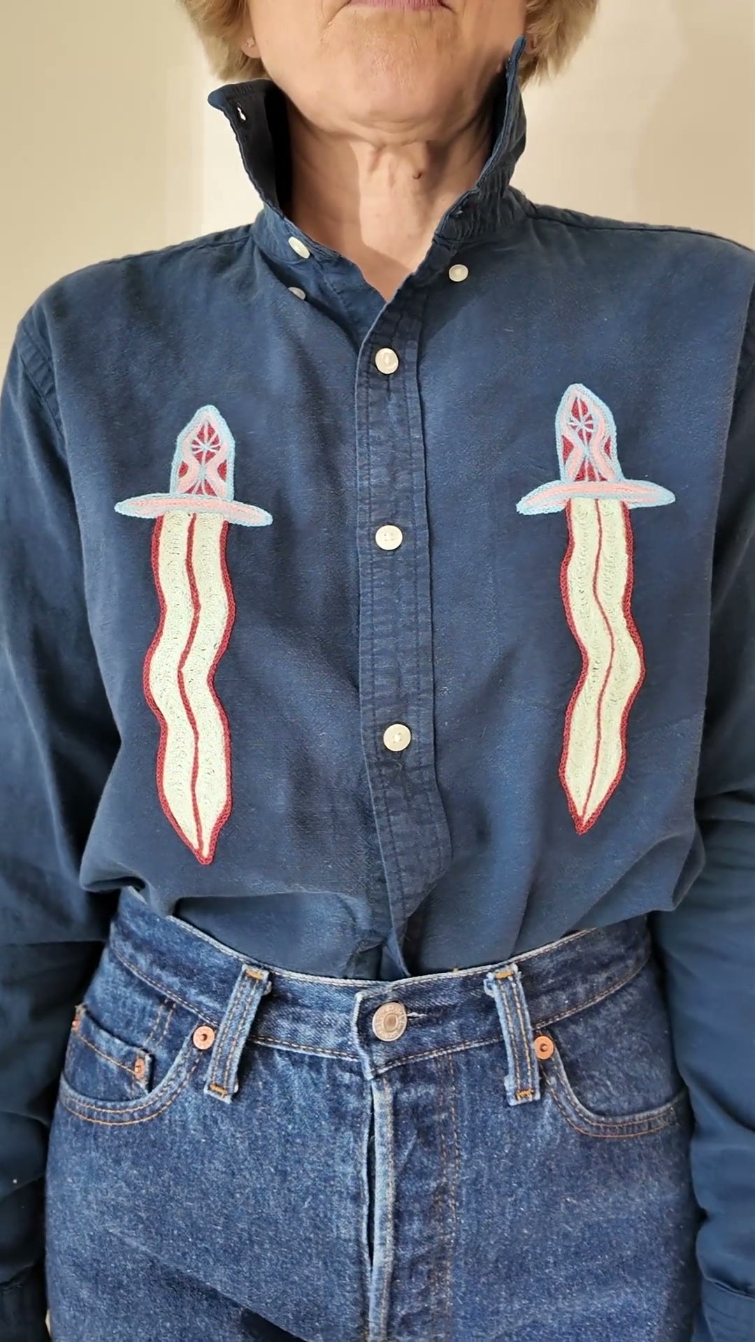 Try-on of the Emily Counts daggers shirt