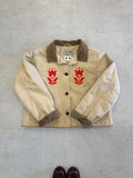 LL Bean Barn Jacket in beige with a pair of red chainstitched tulips
